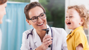 A Doctor and a Little Boy Having Fun